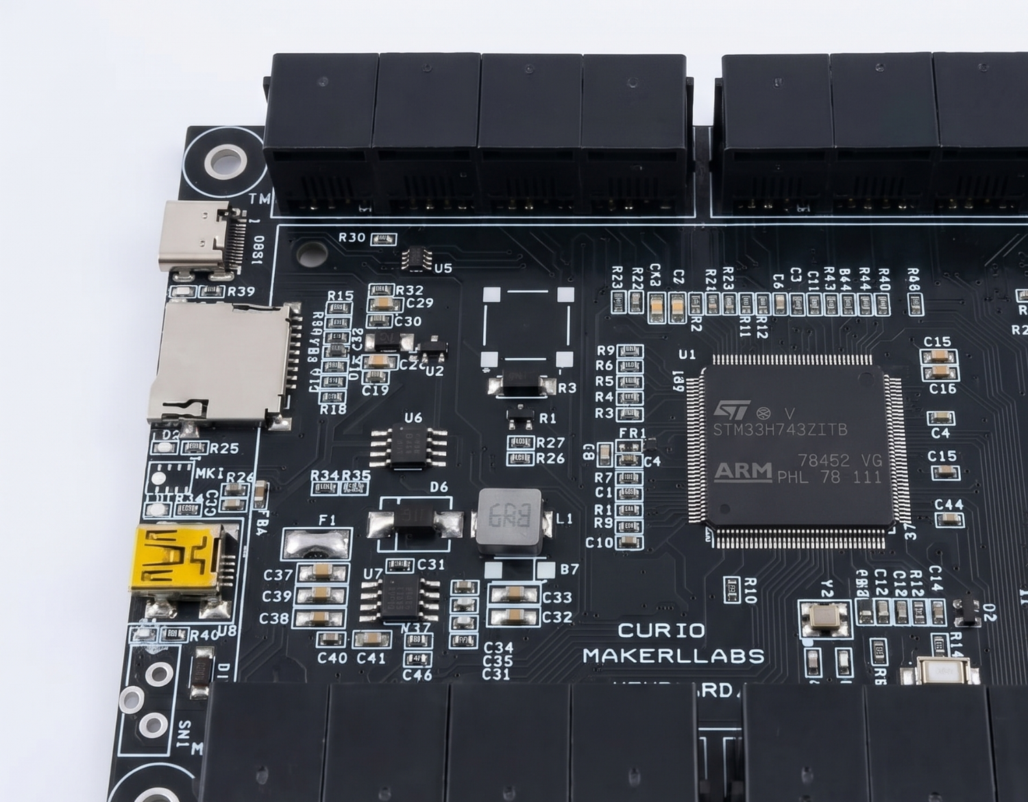 Macro detail of the Curio mainboard silkscreen and ports
